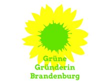 das Logo der Grünen Gründerin: auf weißem Grund eine Sonnenblume, hellgrün der Punkt und die Aufschrift: Grüne Gründerin. Diesen Aufkleber bekommen alle Grünen Gründerinnen zur Auszeichnung überreicht - neben Blumenstrauß und Urkunde.